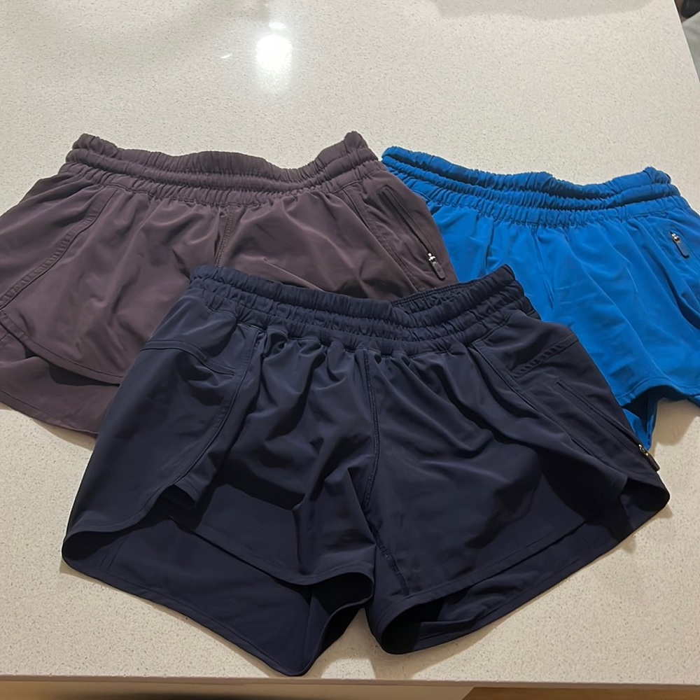 Lululemon shorts, three pairs. Navy blue, dark purple, royal blue.